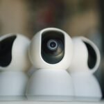 Close-up of sleek security cameras ensuring safety and privacy in indoor settings.