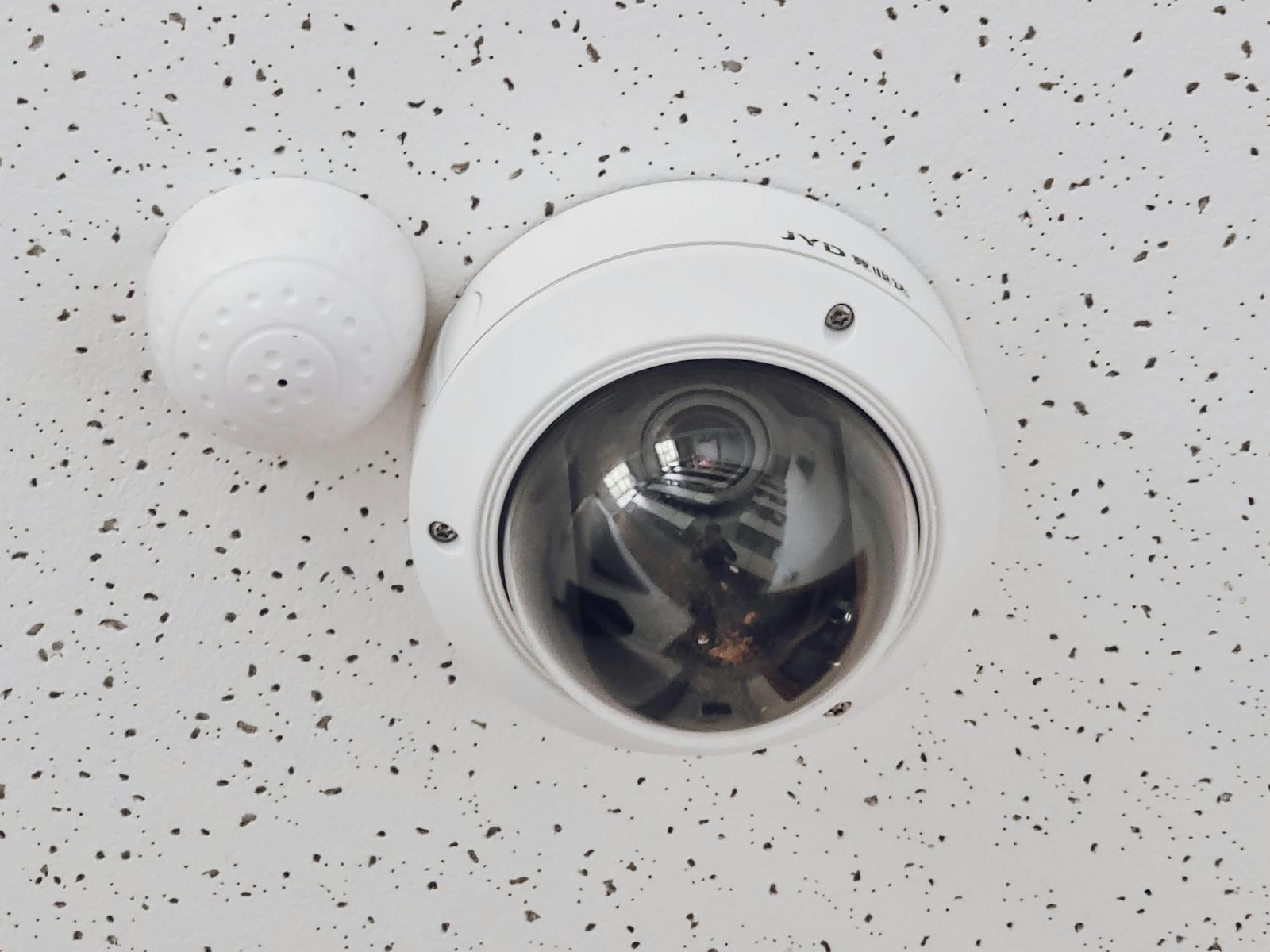 dome security camera mounted on ceiling close-up